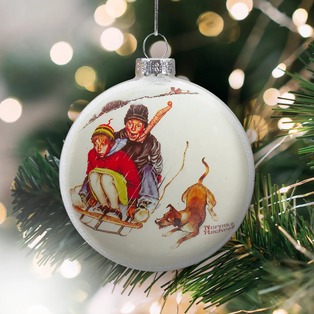 3" Norman Rockwell 'Young Love: Sledding' Glass Christmas Disc Ornament