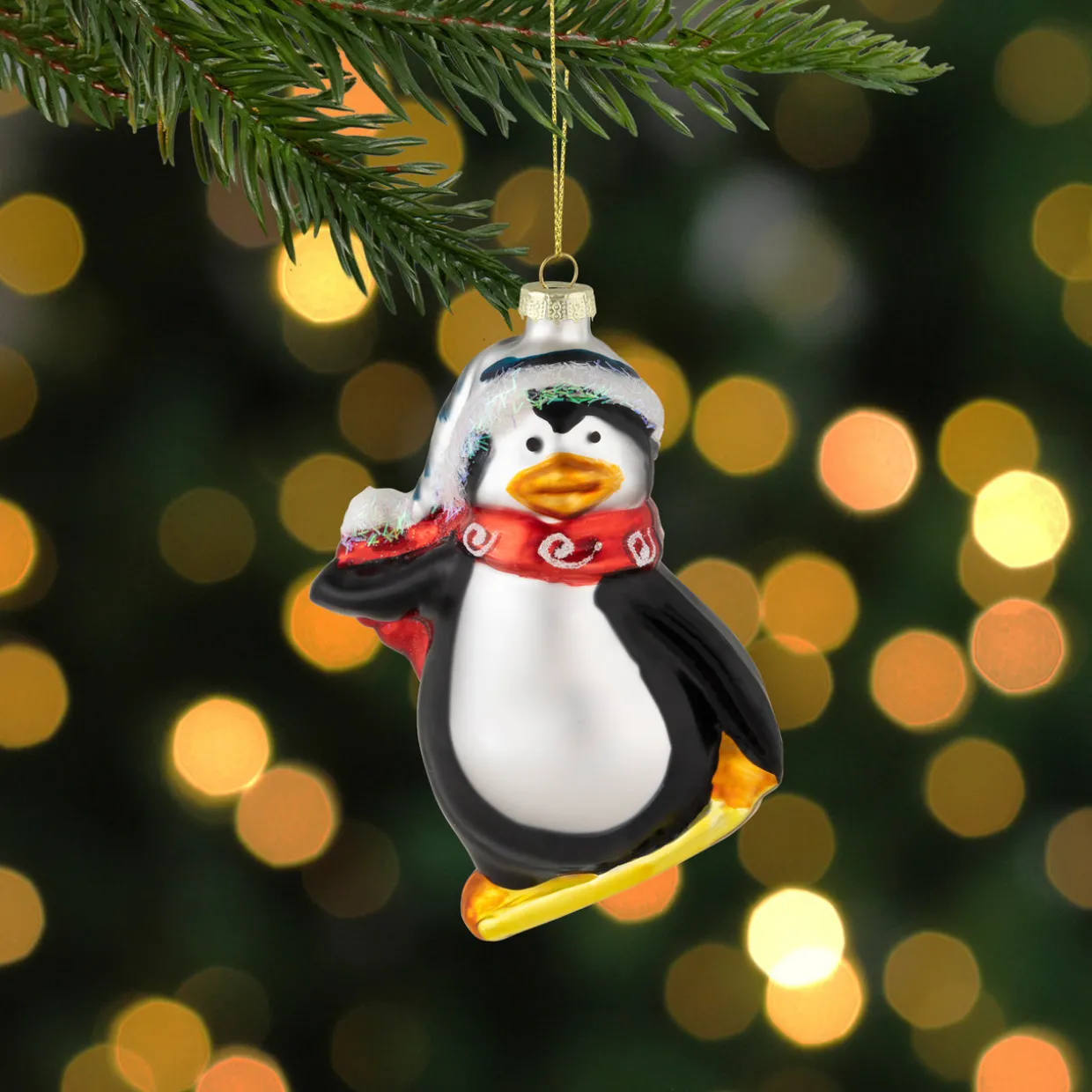4.25" Snowboarding Penguin Glass Christmas Ornament