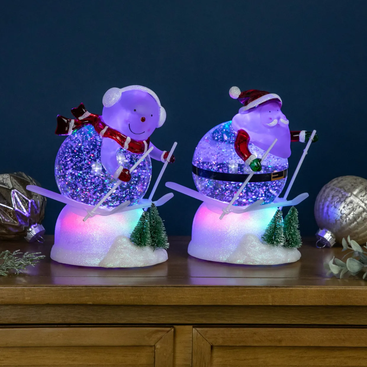 LED Lighted Color Changing Skiing Santa and Snowman Acrylic Christmas Snow Globes - 7.25" - Set of 2