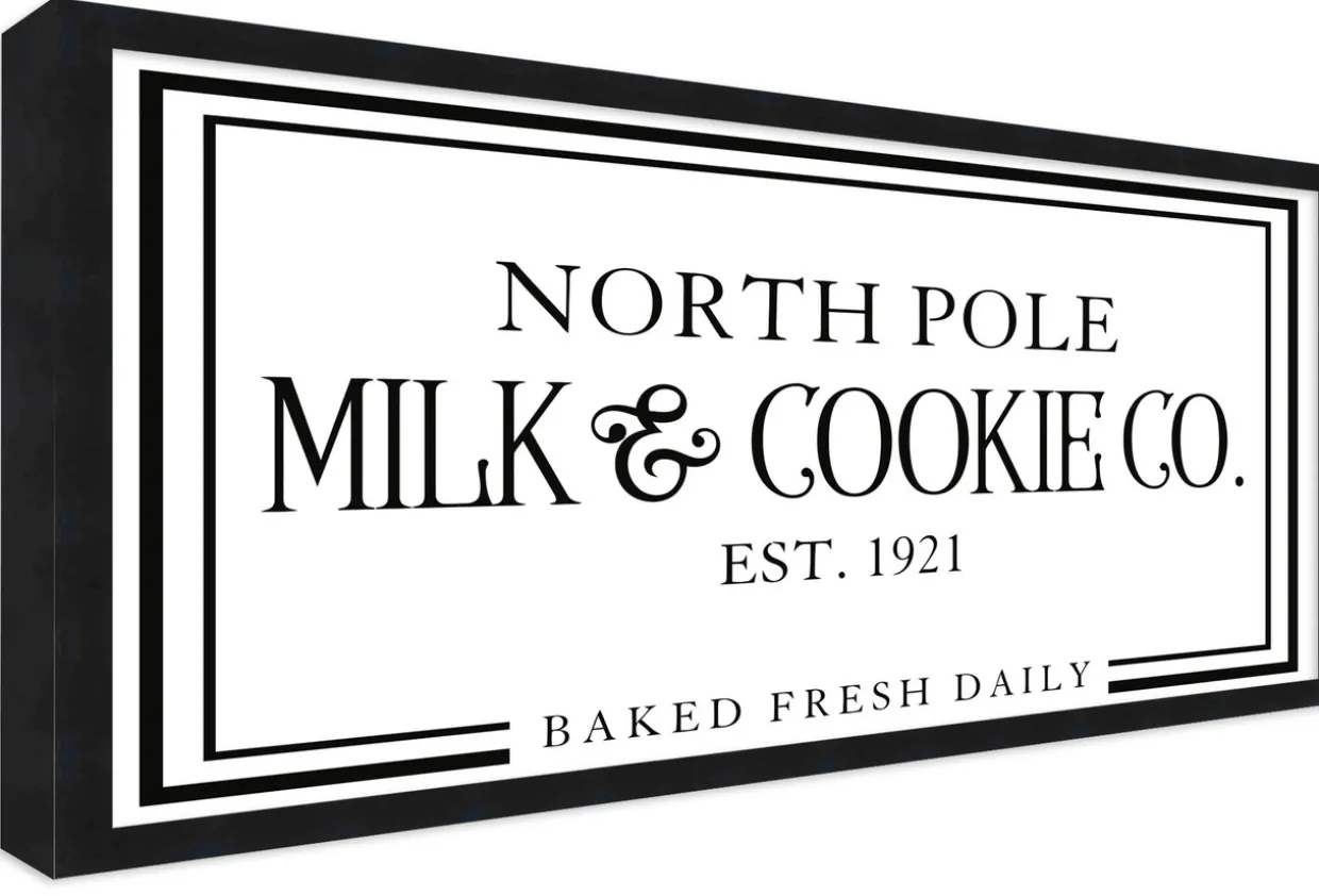 North Pole Milk and Cookie Company 11.5" x 21.5" Framed Christmas Wall Decor Sign Poster in a Black Wooden Frame with UV Acrylic and Hangers
